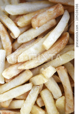 French fries in a cardboard box. Fast food. Fried potatoes. A delicious snack. 104108366