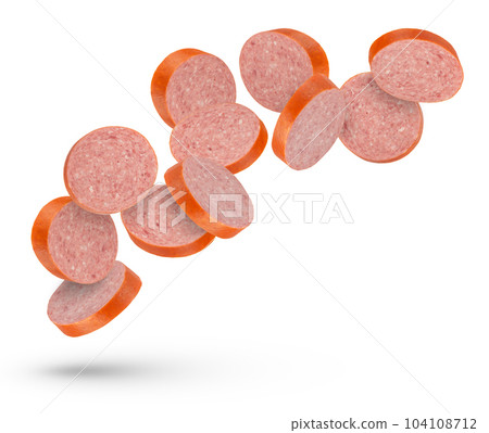 Flying sausage. Slices of smoked sausage on a white isolated background. Salami slices fall on a white background, for insertion into a design or project. Flying sausage. Slices of smoked sausage on a white isolated background. Salami slices fall on a white background, for insertion into a design or project. 104108712