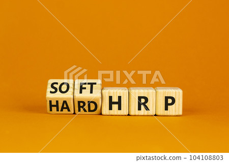 HRP, human resource planning symbol. Turned wooden cubes and changed words hard HRP to soft HRP. Beautiful orange background. Business, HRP, human resource planning concept. Copy space. HRP, human resource planning symbol. Turned wooden cubes and changed words hard HRP to soft HRP. Beautiful orange background. Business, HRP, human resource planning concept. Copy space. 104108803