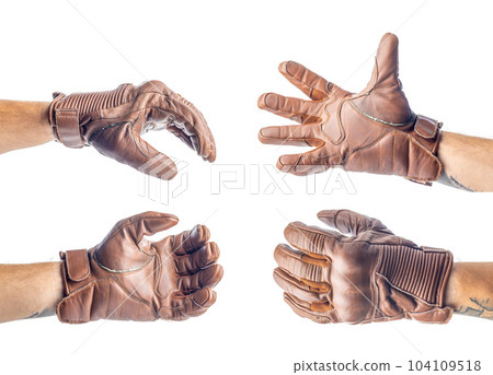 Vintage leather motorcycle gloves on hand isolated on white background. Vintage leather motorcycle gloves on hand isolated on white background. 104109518