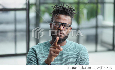 young african american man showing quiet business 104109629