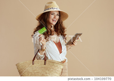smiling trendy woman in blouse and shorts smiling trendy woman in blouse and shorts 104109770