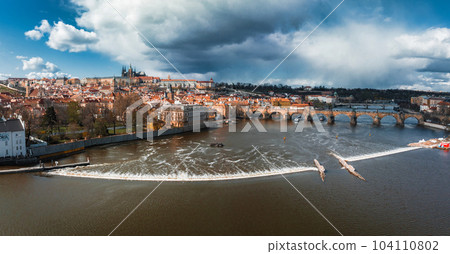 Scenic spring panoramic aerial view of the Old Town pier architecture and Charles Bridge over Vltava river in Prague, Czech Republic 104110802