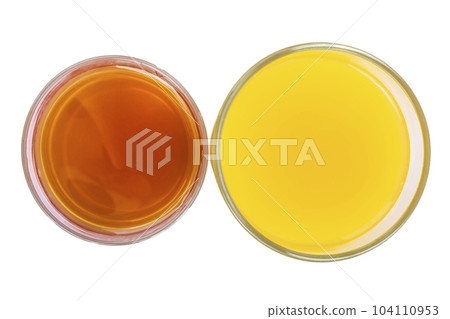 Two glasses of fresh orange and apple juice isolate 104110953