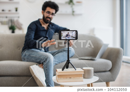 Positive influencer have broadcast on modern smartphone 104112050