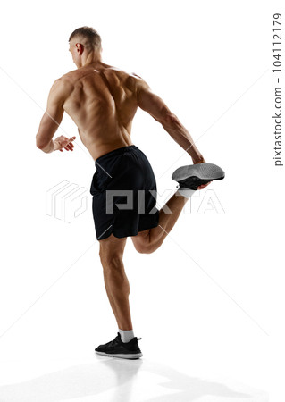 Full-length portrait of professional sportsman with relief, fit, strong, muscular body doing warming up exercises against white studio background Full-length portrait of professional sportsman with relief, fit, strong, muscular body doing warming up exercises against white studio background 104112179