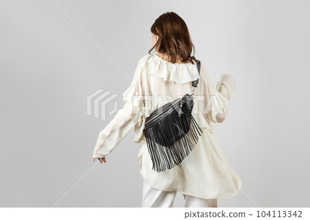 Woman with Black Leather Crossbody Fanny Pack Bag Woman with Black Leather Crossbody Fanny Pack Bag 104113342