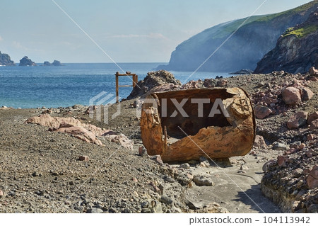 Old rusty boiler scrap metal on the shore 104113942