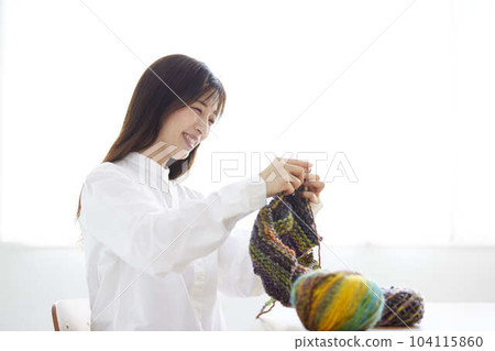 A woman who makes handcrafted items at home A woman who makes handcrafted items at home 104115860