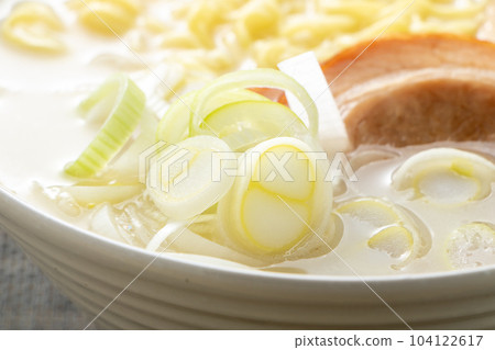 Close-up of white onion in tonkotsu ramen. 104122617