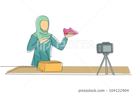 Single one line drawing beautiful Arab female fashion blogger talking about trendy sneakers while making a video for her blog. Blogging about new products, trends. Continuous line draw design vector Single one line drawing beautiful Arab female fashion blogger talking about trendy sneakers while making a video for her blog. Blogging about new products, trends. Continuous line draw design vector 104122904