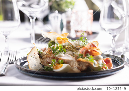 Chicken breasts served as low carb and high protein meal with eggs, ham and vegetables Chicken breasts served as low carb and high protein meal with eggs, ham and vegetables 104123349