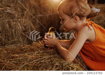 Child holding a duck Child holding a duck 104123782
