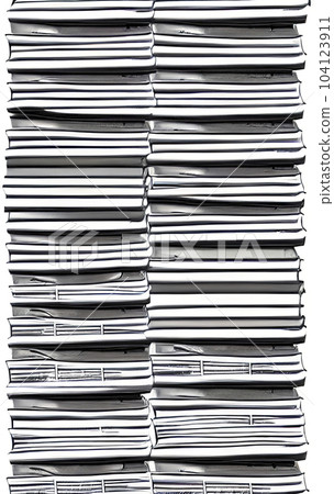 close-up stack of daily newspapers 104123911