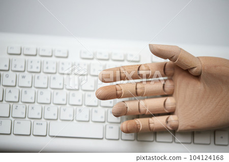 Wooden robot hand fingers and computer keyboard Wooden robot hand fingers and computer keyboard 104124168