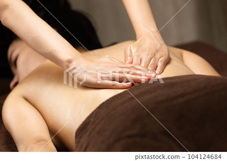 Oil massage on the back. 104124684