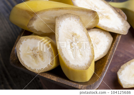 Sliced ripe yellow banana, close up 104125686