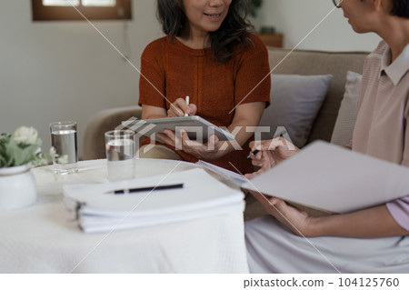 Insurance agent make offer to elderly woman life insurance options. Estate agent, financial adviser, Insurance agent concept 104125760