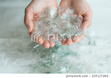 Hand photo with a piece of plastic 104125968