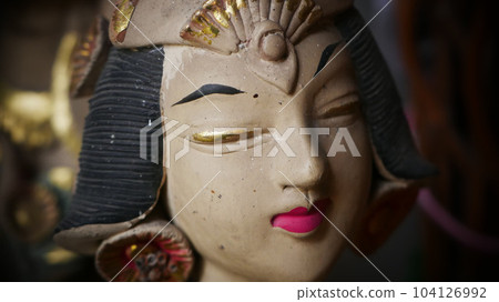 Beautiful artistic statue of a Balinese or javanese dancer used as garden decoration, javanese gnome indonesia Beautiful artistic statue of a Balinese or javanese dancer used as garden decoration, javanese gnome indonesia 104126992