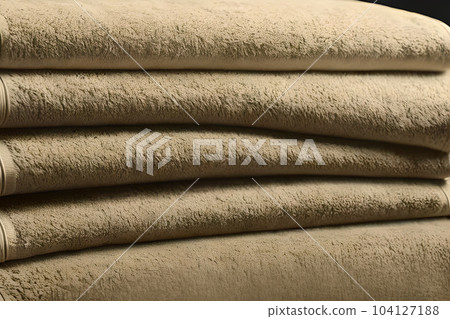 Close up clean brown folded towel stack each other. 104127188