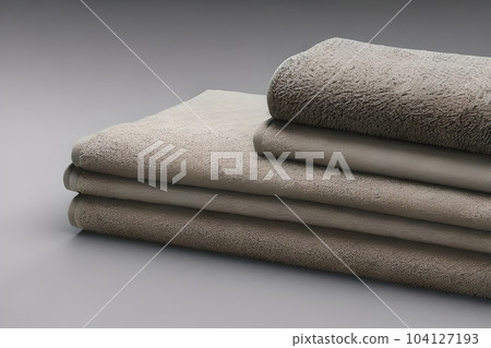Clean various size soft gray color folded towel nice and tidy stack each other for fitness, bath, swimming, massage and spa marketing background and design material isolated on grey background. Clean various size soft gray color folded towel nice and tidy stack each other for fitness, bath, swimming, massage and spa marketing background and design material isolated on grey background. 104127193