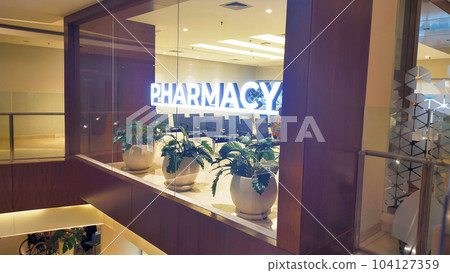 A pharmacy department sign allow sick patient to buy or pickup their medication. 104127359