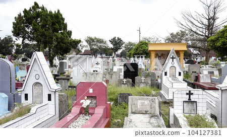 Public cemetery with varied graves. Public cemetery with varied graves. 104127381