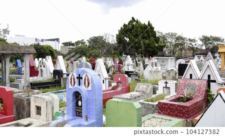 Public cemetery with varied graves. 104127382