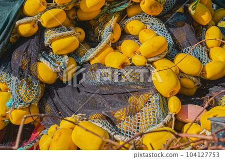 Tangled fishing nets dry after fishing, close-up, selective focus. Background for industrial fishing concept 104127753