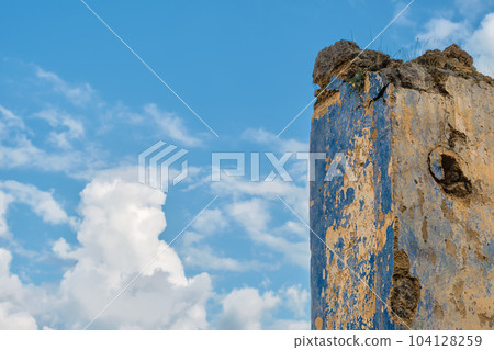 The ruins of the abandoned Greek city of Levissi near the village of Kayakoy in Fethiye Turkey, against the backdrop of cumulus clouds, the tragedy of wars. Site of the ancient city of Karmilissos The ruins of the abandoned Greek city of Levissi near the village of Kayakoy in Fethiye Turkey, against the backdrop of cumulus clouds, the tragedy of wars. Site of the ancient city of Karmilissos 104128259