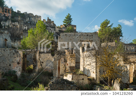 View of the abandoned city next to Kayakoy. Karmilissos abandoned ghost town in Fethiye - Turkey, ruins of stone houses. Site of the ancient Greek city View of the abandoned city next to Kayakoy. Karmilissos abandoned ghost town in Fethiye - Turkey, ruins of stone houses. Site of the ancient Greek city 104128260