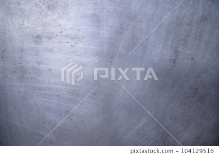 Scratched industrial Metalplate surface can be used as a background and texture Scratched industrial Metalplate surface can be used as a background and texture 104129516