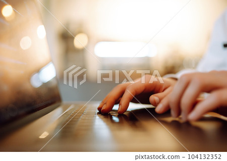 Female hands working on laptop, close-up. Freelance, online course, remote work, lifestyle concept. Female hands working on laptop, close-up. Freelance, online course, remote work, lifestyle concept. 104132352