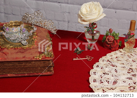 White Rose in Vase Next to Vintage Rhinestone Rose and Perfume Bottle 104132713