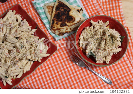Pasta Carbonara With Italian Flat Bread on Buffet Table 104132881