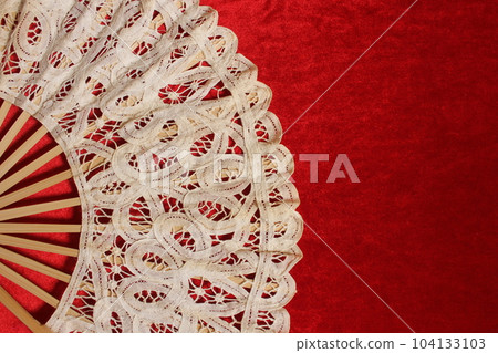 Vintage Lace Hand Fan On Red Velvet Background 104133103