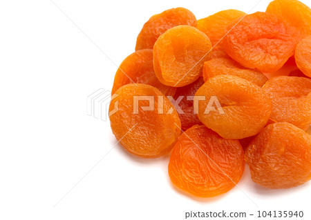Dried apricots on white background. Dried apricots on white background. 104135940