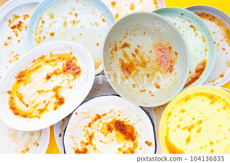 Dirty dishes on yellow background. Top view 104136835