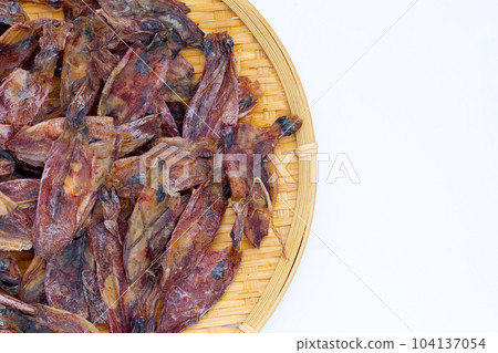 Dried squid on white background. 104137054