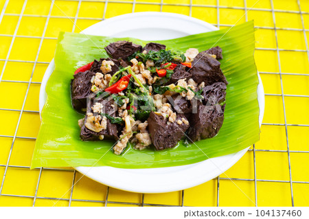 Stir-fried chicken blood cubes and minced pork with holy basil Stir-fried chicken blood cubes and minced pork with holy basil 104137460