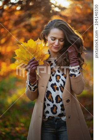 modern female in brown coat and yellow hat modern female in brown coat and yellow hat 104140330