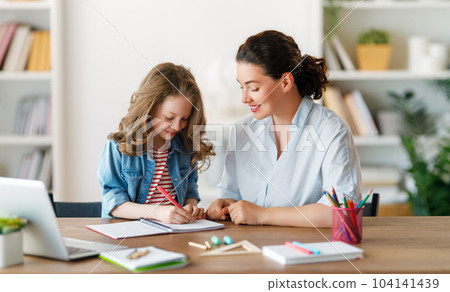 Girl doing homework or online education. 104141439