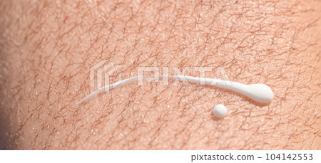 Close up of Sunscreen Protection or Sun Cream on human skin. Skin and Body Care. SPF Lotion or Moisturizing Sunblock to protect skin from the sun UV Sun screen cosmetic cream texture skincare product Close up of Sunscreen Protection or Sun Cream on human skin. Skin and Body Care. SPF Lotion or Moisturizing Sunblock to protect skin from the sun UV Sun screen cosmetic cream texture skincare product 104142553