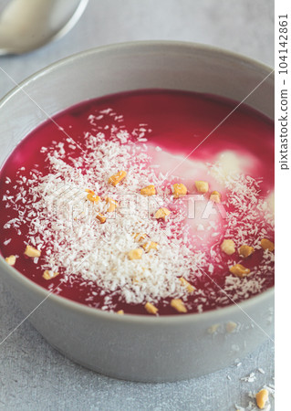 Malabi - traditional Arabic dessert. Milk pudding with rose syrup and nuts. 104142861
