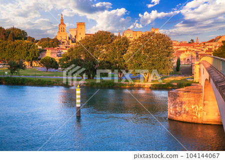 Avignon, Provence, France. Sunset golden hour with Rhone River and medieval city downtown. Avignon, Provence, France. Sunset golden hour with Rhone River and medieval city downtown. 104144067
