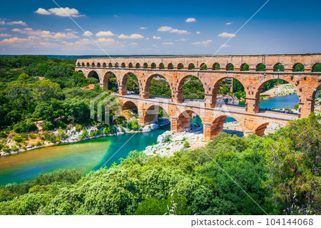 Pont du Gard, France. Ancient three-tiered aqueduct, built in Roman Empire times on the river Gardon, Provence. Pont du Gard, France. Ancient three-tiered aqueduct, built in Roman Empire times on the river Gardon, Provence. 104144068