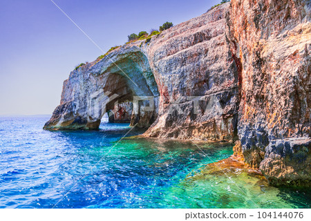 Zakynthos, Greece. Rock arches of Blue Caves, Agios Nikolaos boat trip. Zakynthos, Greece. Rock arches of Blue Caves, Agios Nikolaos boat trip. 104144076