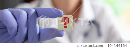 Question mark in hand of general practitioner or cardiologist in clinic Question mark in hand of general practitioner or cardiologist in clinic 104144164