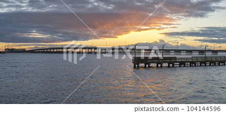 Barron Collier Bridge and Gilchrist Bridge in Florida with moving traffic. Transportation infrastructure in Charlotte County connecting Punta Gorda and Port Charlotte over Peace River 104144596